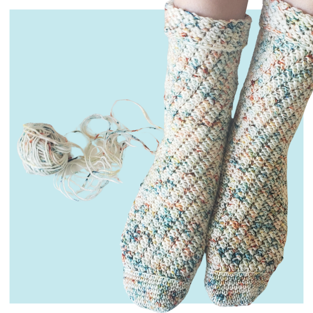 A family story crochet socks on turquoise background.