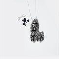 Alpaca pewter pendant against white background with 3 drawn hearts.