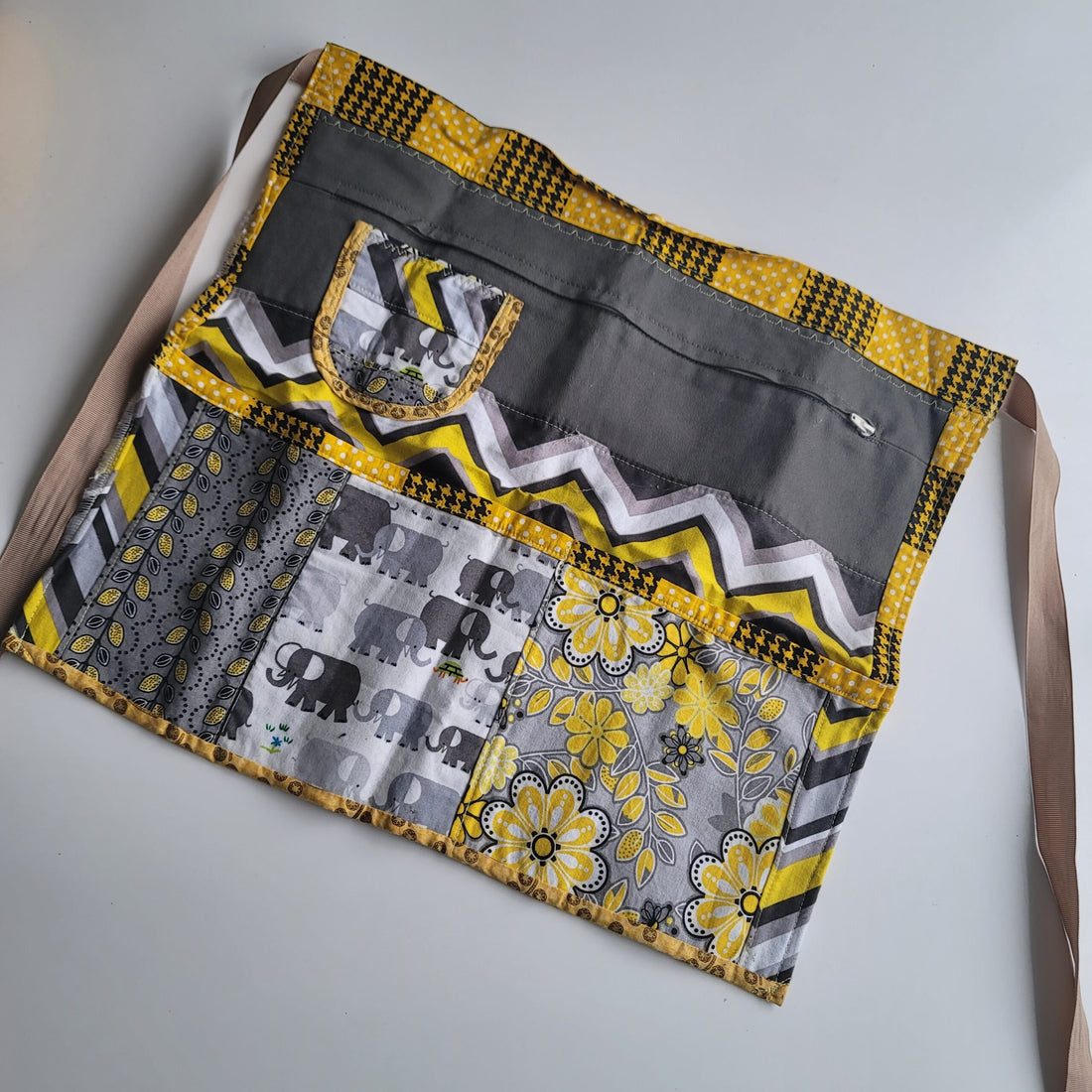 Yellow, white and gray apron front.