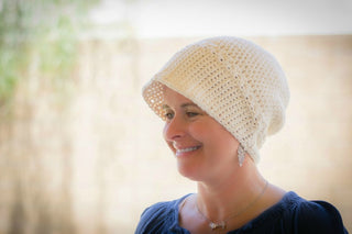 Bella Crochet sun Hat worn by woman.