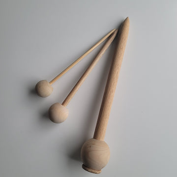 3 wooden broomstick crochet needles.