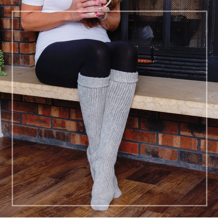 Climbing Vines Knee High Socks worn in front of fireplace.