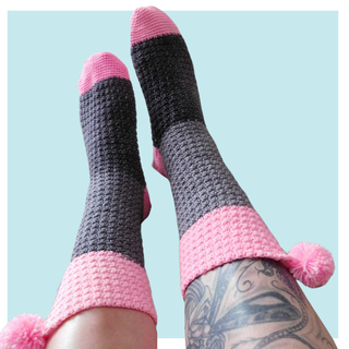 Confiture crochet socks on turquoise background.