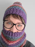 Da Boss Crochet Hat and Cowl worn by woman wearing glasses on white background.