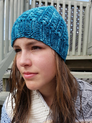 Blue Eliane Crochet Hat worn by teenager outside.