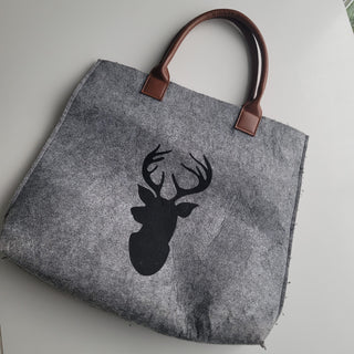 Felted tote bag with deer silhouette.