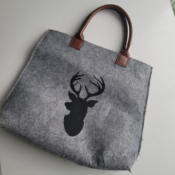 Felted tote bag with deer silhouette.