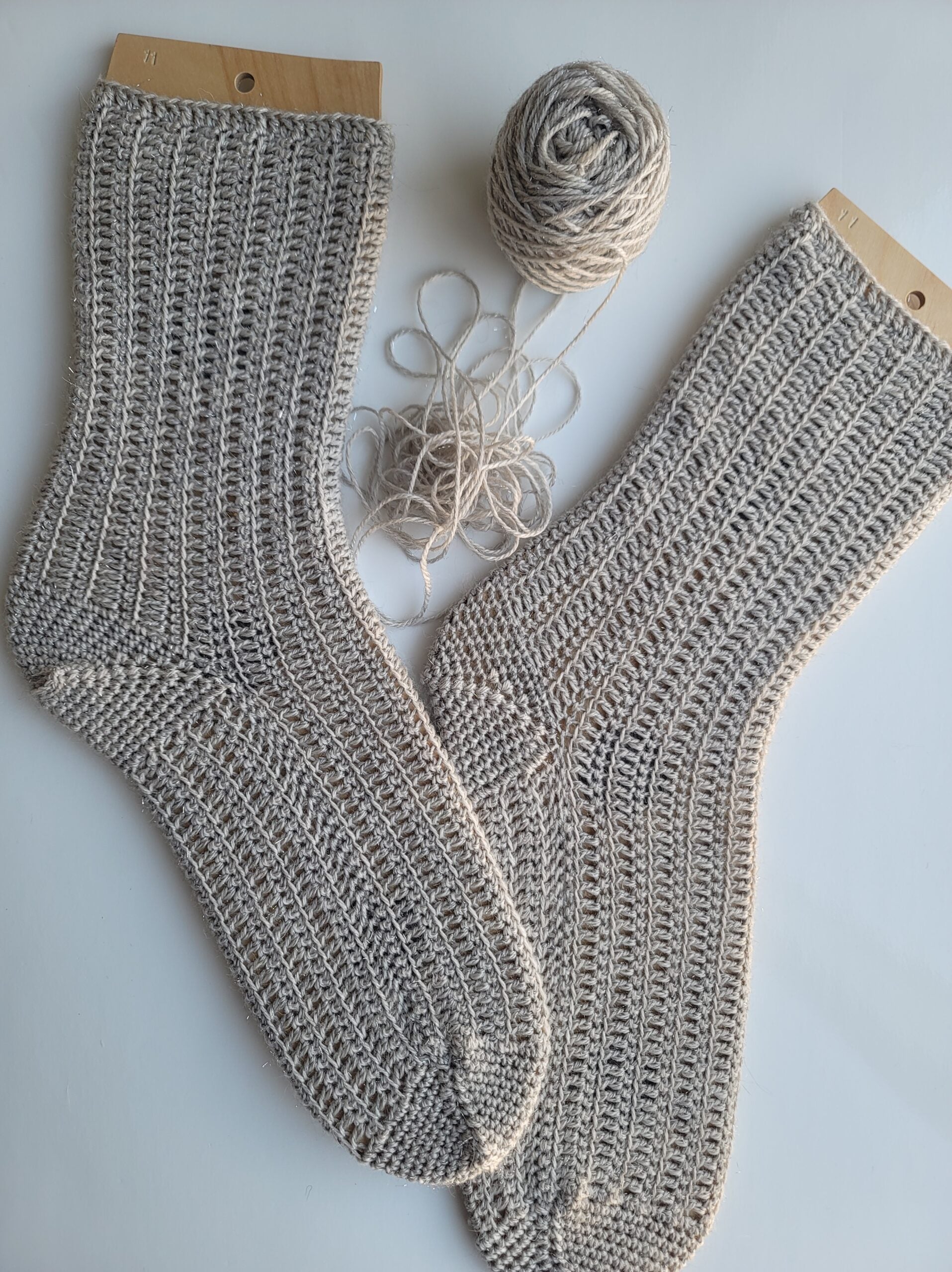 Flanken crochet socks on white background.