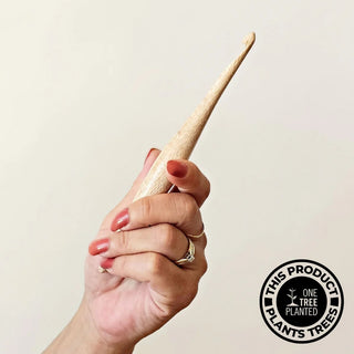 Furls Silver Oak Hooks held against off white background.