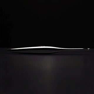 Furls Streamline Metal Silver Hooks on black background.