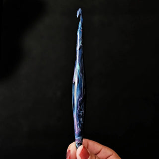 Furls Streamline Swirl Supernova held at bottom.