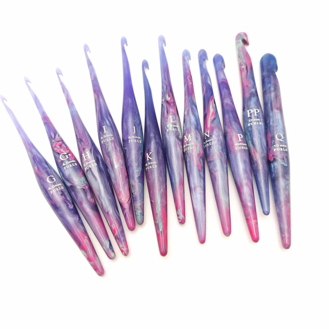 Furls Streamline Taurus Hooks held at bottom on black background.