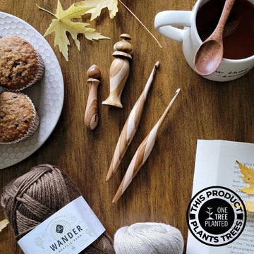 Furls Streamline Wood Carousel hook and needle minder with accessories flatlay.