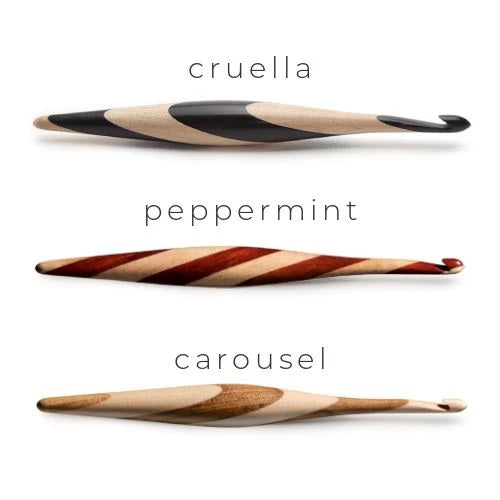 Furls Streamline Wood Carousel hook and needle minder with accessories flatlay.