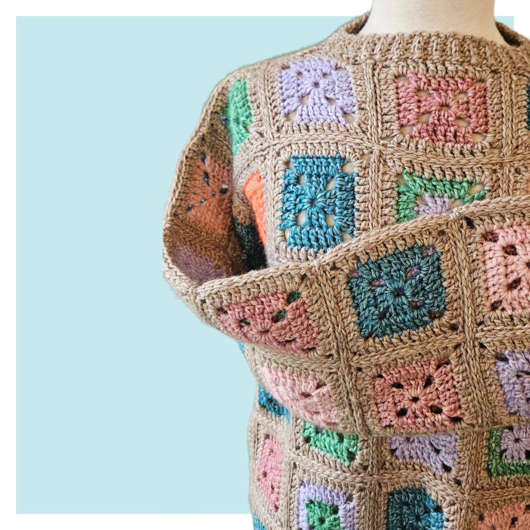 Granny lives here crochet sweater on turquoise background