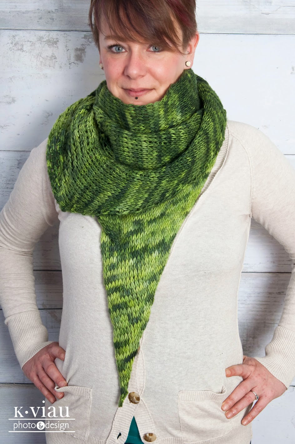 Green Tea Tunisian Crochet Shawl worn by woman wearing beige sweater.