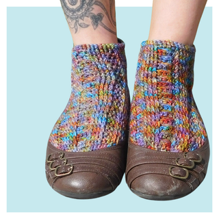 Josephine Crochet Socks on turquoise background.