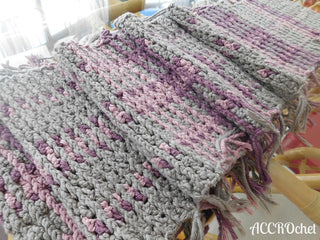 Kravitz crochet woven scarf on table.