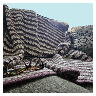 Lavender_Mist crochet throw on turquoise background.