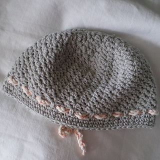 Gray Lemonade Crochet Hat on white background.