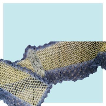 Libellule crochet stole on turquoise background.