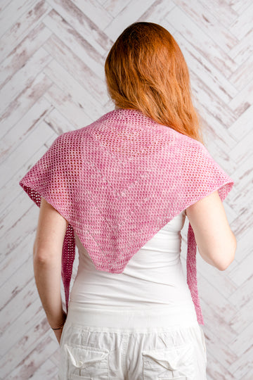 Loiseau Rose Crochet Shawl worn by woman with red hair with her back turned.