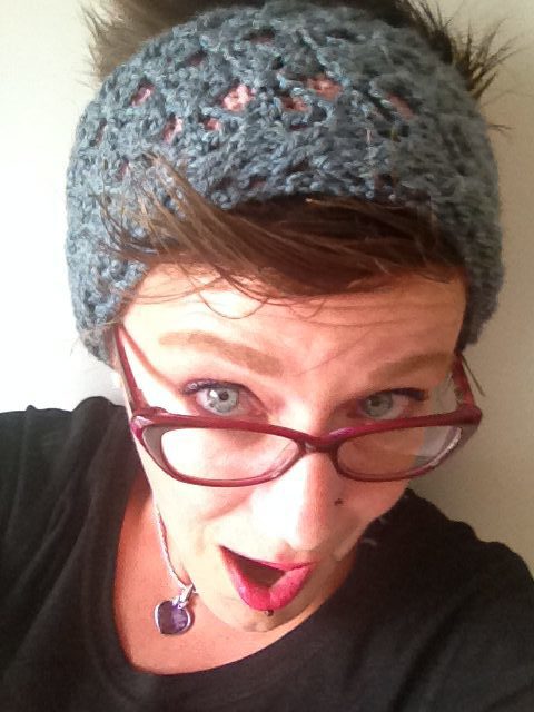 Méli Crochet Headband worn by woman wearing glasses.