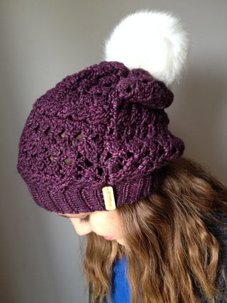 Purple Mélo Crochet Hat worn by teenager looking down.