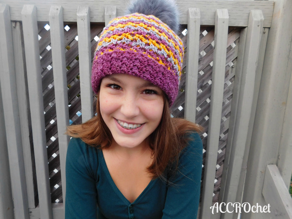 Milki crochet hat worn by teen outside.