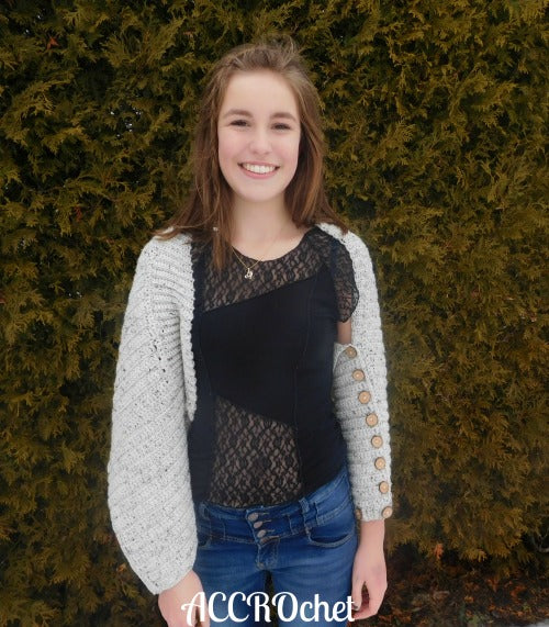 Oatmeal-Crochet Wrap worn by young woman outside.