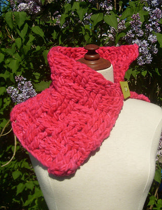 Pink Yoda Crochet Cowl on mannequin in front of lilac tree.