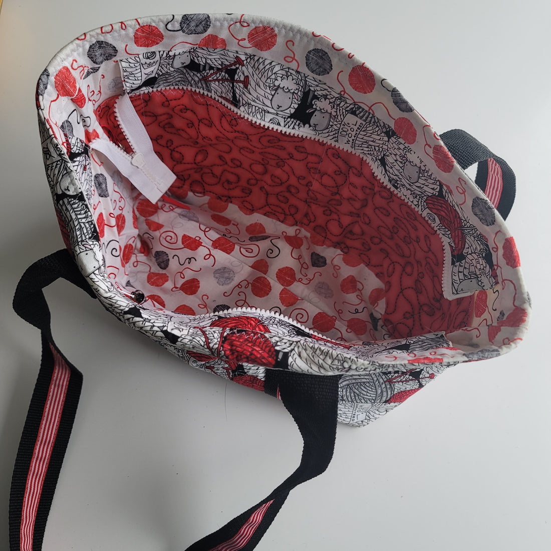 Project bag red, white and black fabric with sheep.