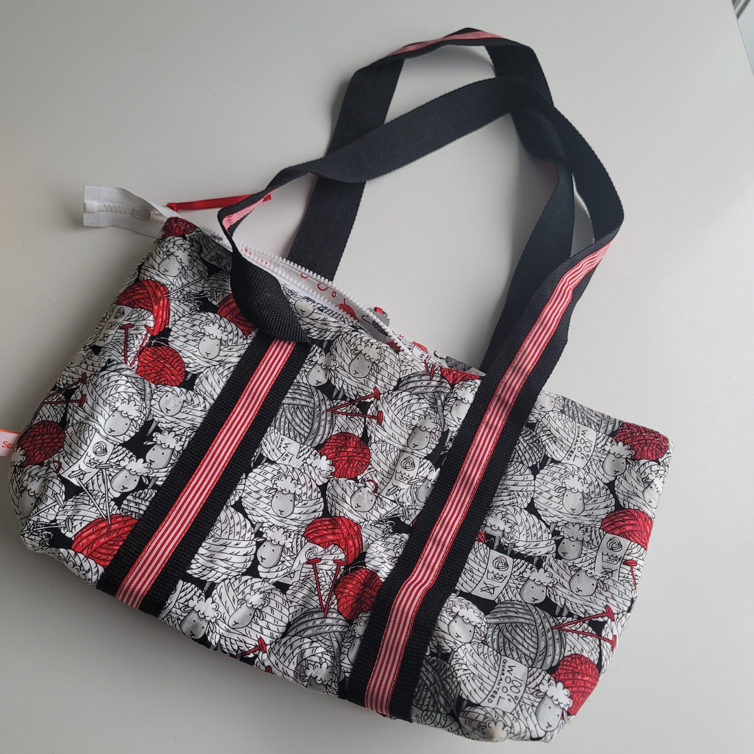 Project bag red, white and black fabric with sheep.