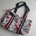Project bag red, white and black fabric with sheep.