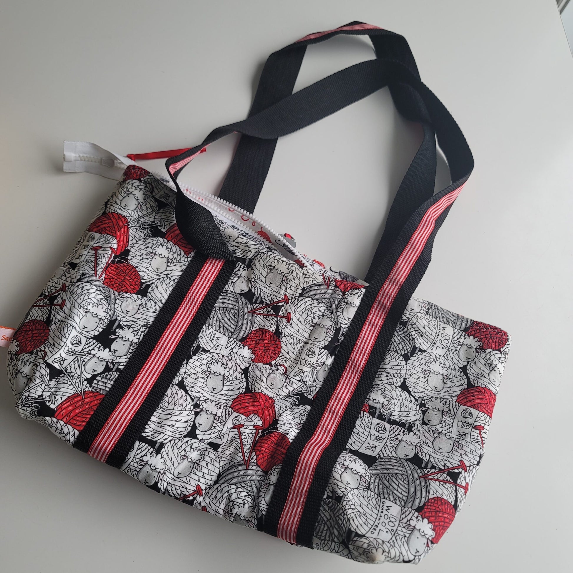 Project bag red, white and black fabric with sheep.