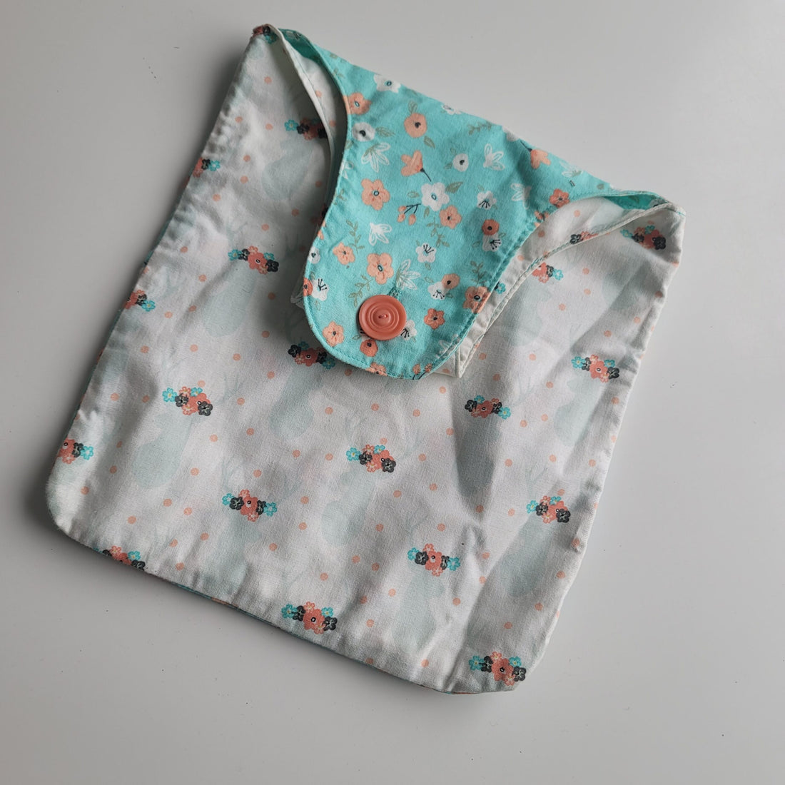 Turquoise white and orange project bag with deer silhouettes.