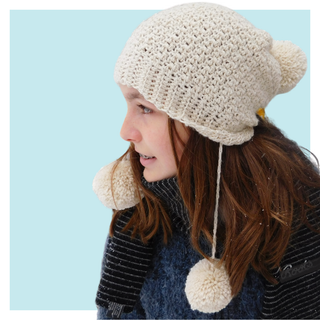 Snow Angel Crochet hat worn by teen on turquoise background.