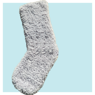 Softest crochet stocking on turquoise background.