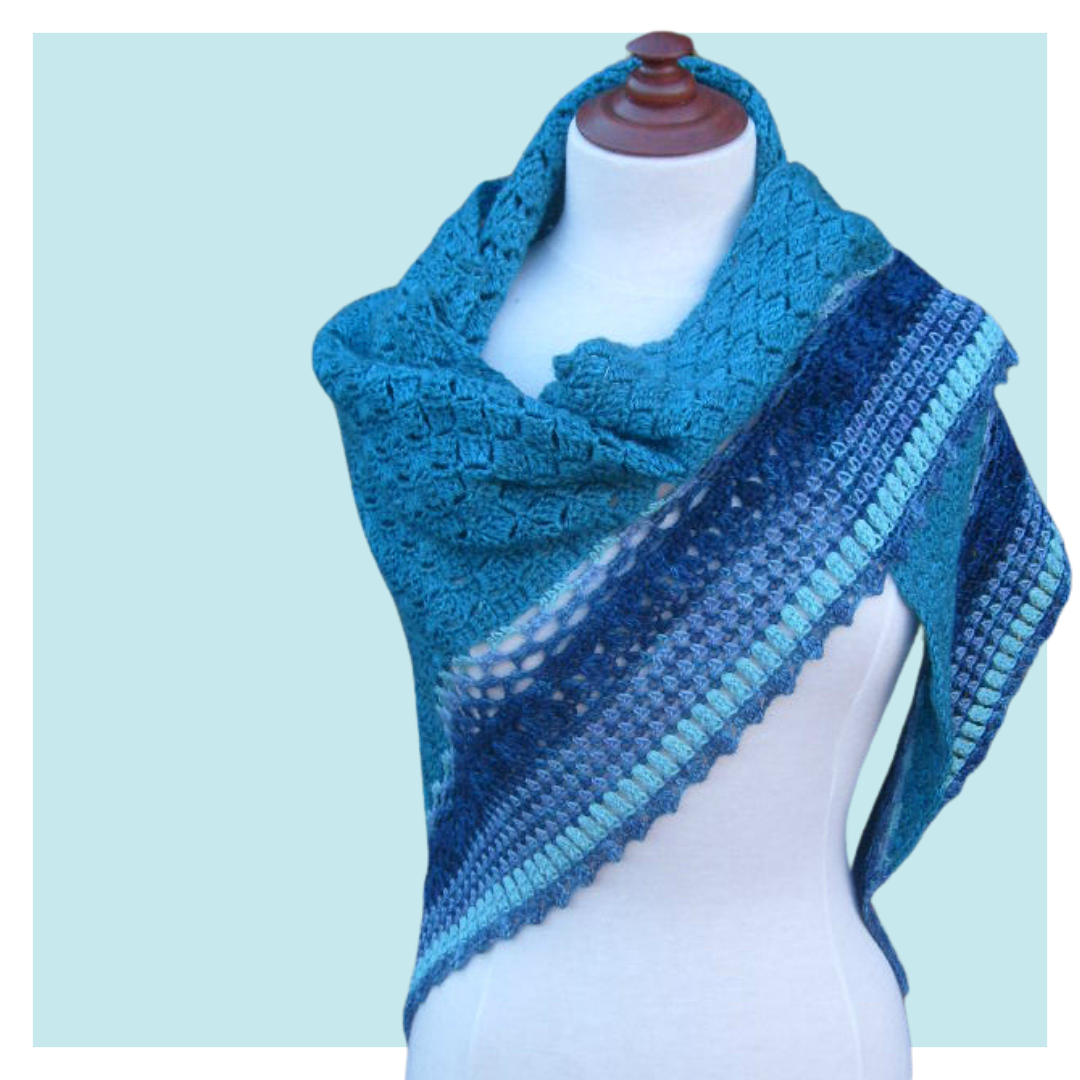 Summer Rain Crochet Shawl on turquoise background.