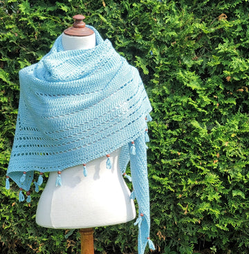 Sup-coconut-crochet shawl on mannequin outside.