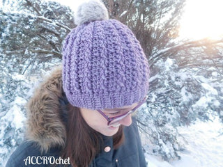 Trinity cabled hat crochet pattern worn outside in winter.