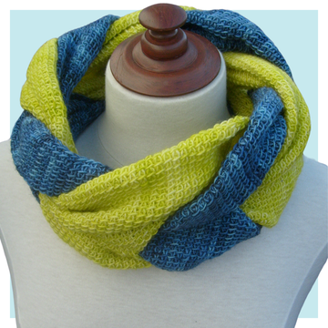 Twisted Tunisian Crochet Pattern on mannequin against a turquoise background.