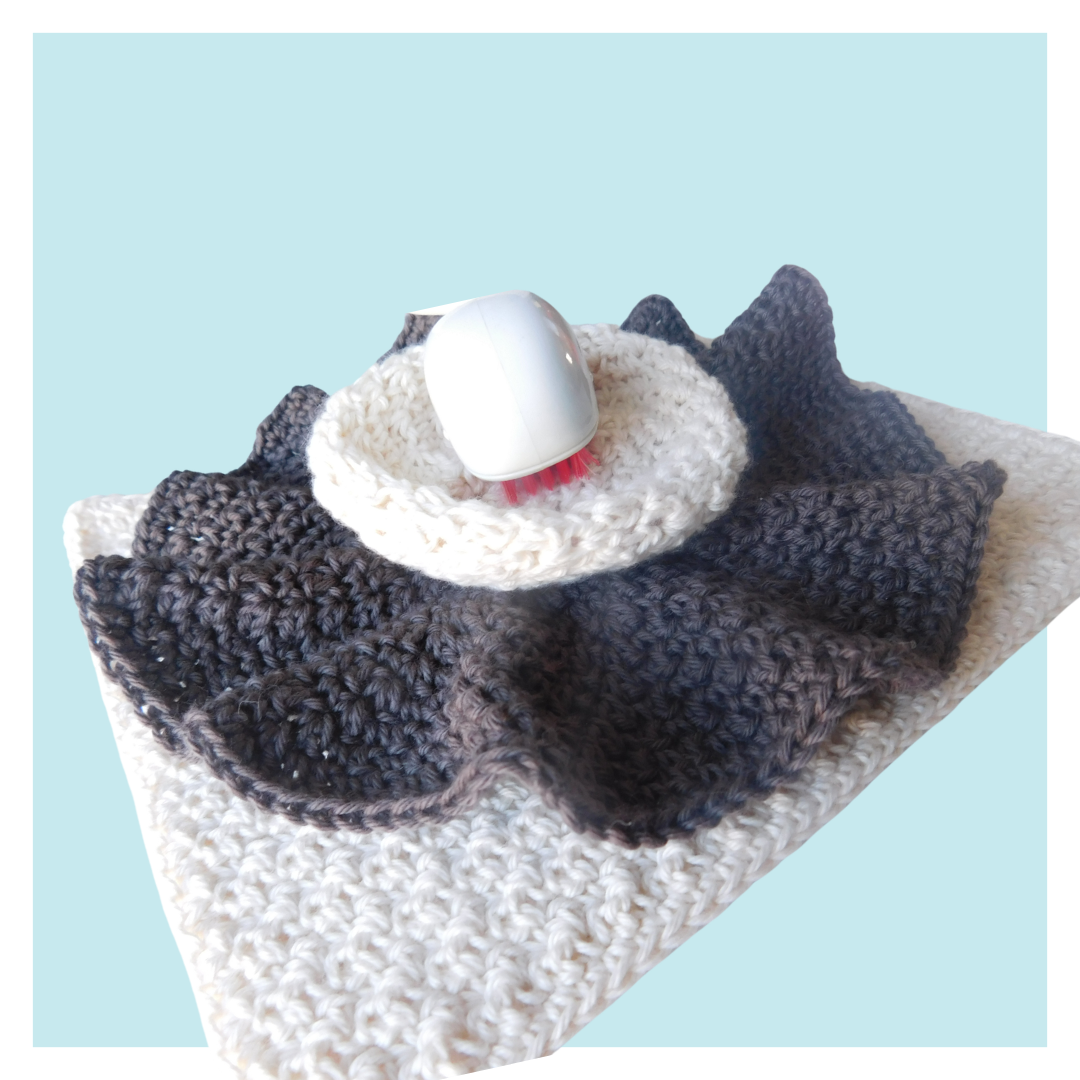 Trio of crochet washcloths on turquoise background.