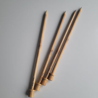 4 wooden knitting needles.