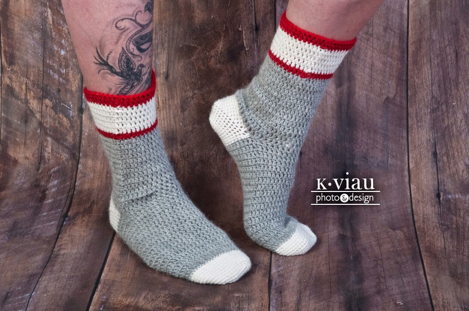 Workman Crochet Socks worn against dark background.