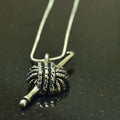 Yarn and hook pewter pendant.