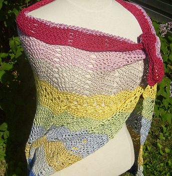 Bubblegum crochet shawl on mannequin outdoors.