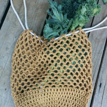 Estelle crochet market bag with kale.