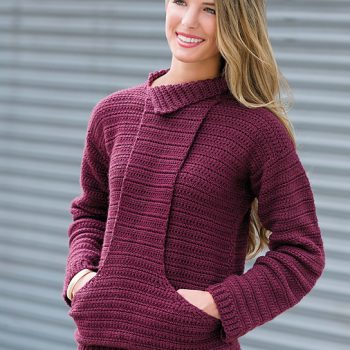 Woman wearing purple crochet pullover with front pocket