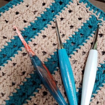 Striped crochet dishcloth with 3 hooks